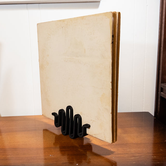 an open book sitting on top of a wooden table