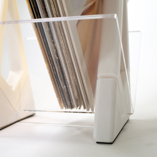 a stack of records in a clear holder