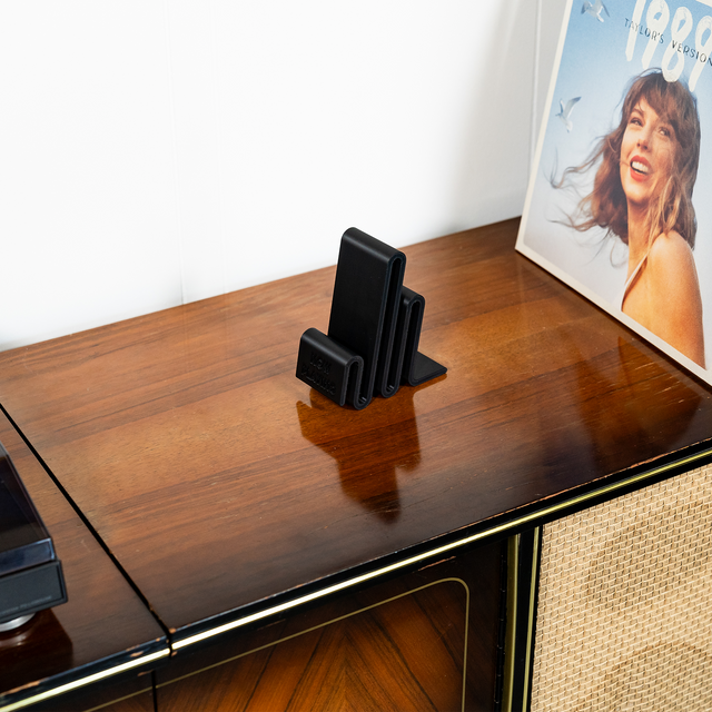 a table with a magazine and a radio on it