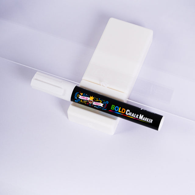 a tube of glue sitting on top of a white surface