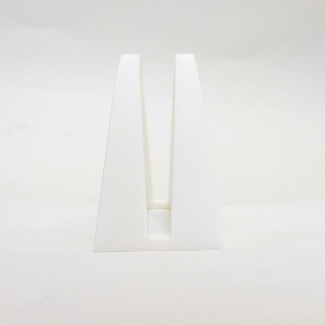 a small white object on a white surface