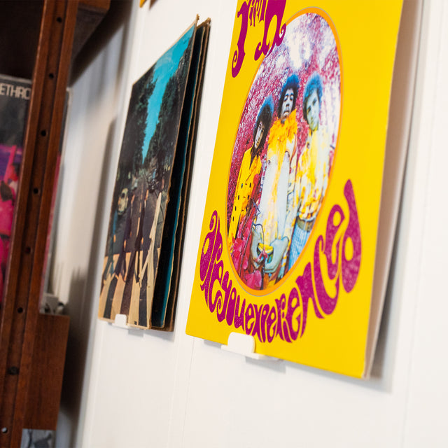 a group of posters hanging on a wall