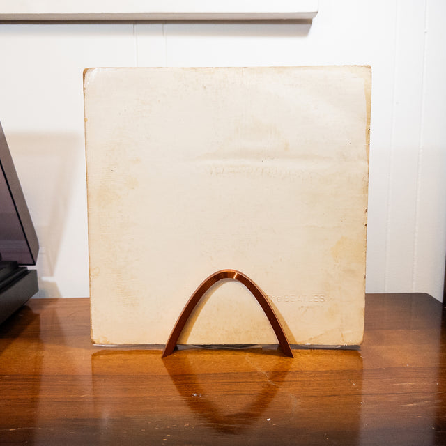 a piece of paper sitting on top of a wooden table