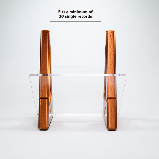 a pair of wooden pens sitting on top of a clear shelf