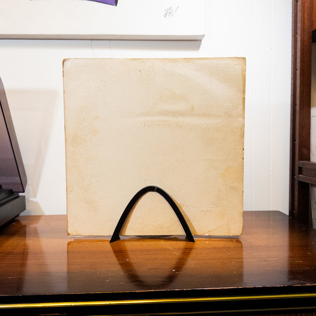 a piece of paper sitting on top of a wooden table