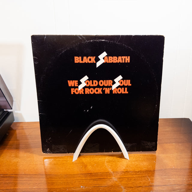 a black album sitting on top of a wooden table