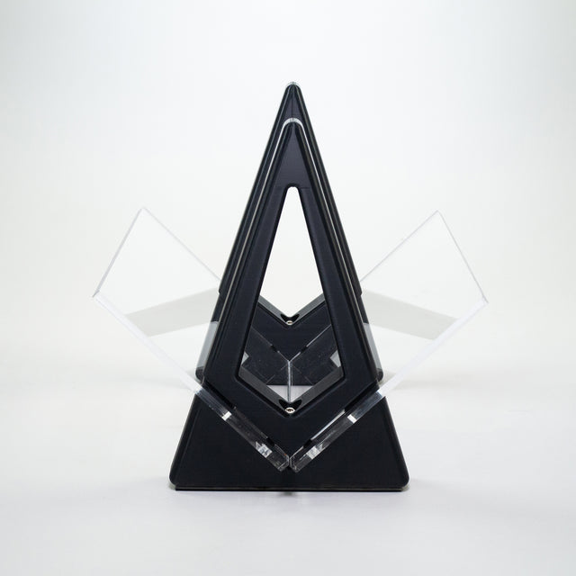 a black and clear sculpture on a white background
