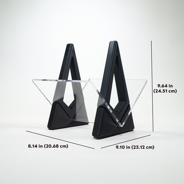 a pair of black glass bookends sitting on top of a table