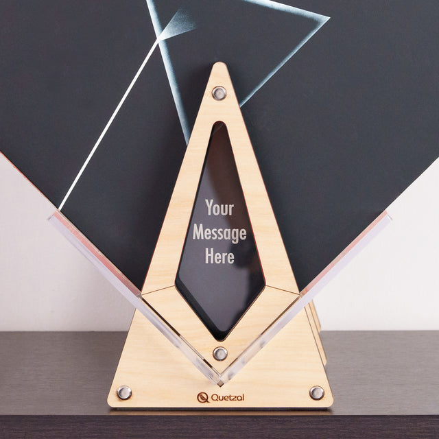 a wooden triangle award with a black background